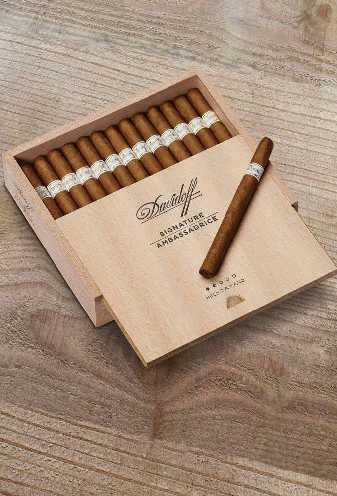 Indulge in the luxury of Davidoff Signature Ambassadrice cigars. A refined smoke with creamy, subtle notes. Experience elegance with every puff.